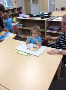 A girl and teacher working together at Lutz Montessori School and Montessori at Trinity Oaks
