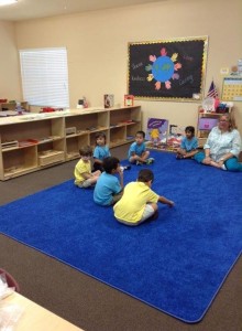 A group of children sitting together at Lutz Montessori School and Montessori at Trinity Oaks